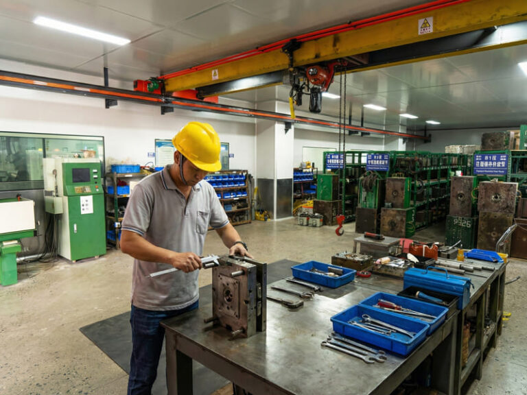 In-house precision mold tooling workshop for high-volume wholesale cosmetic packaging production.